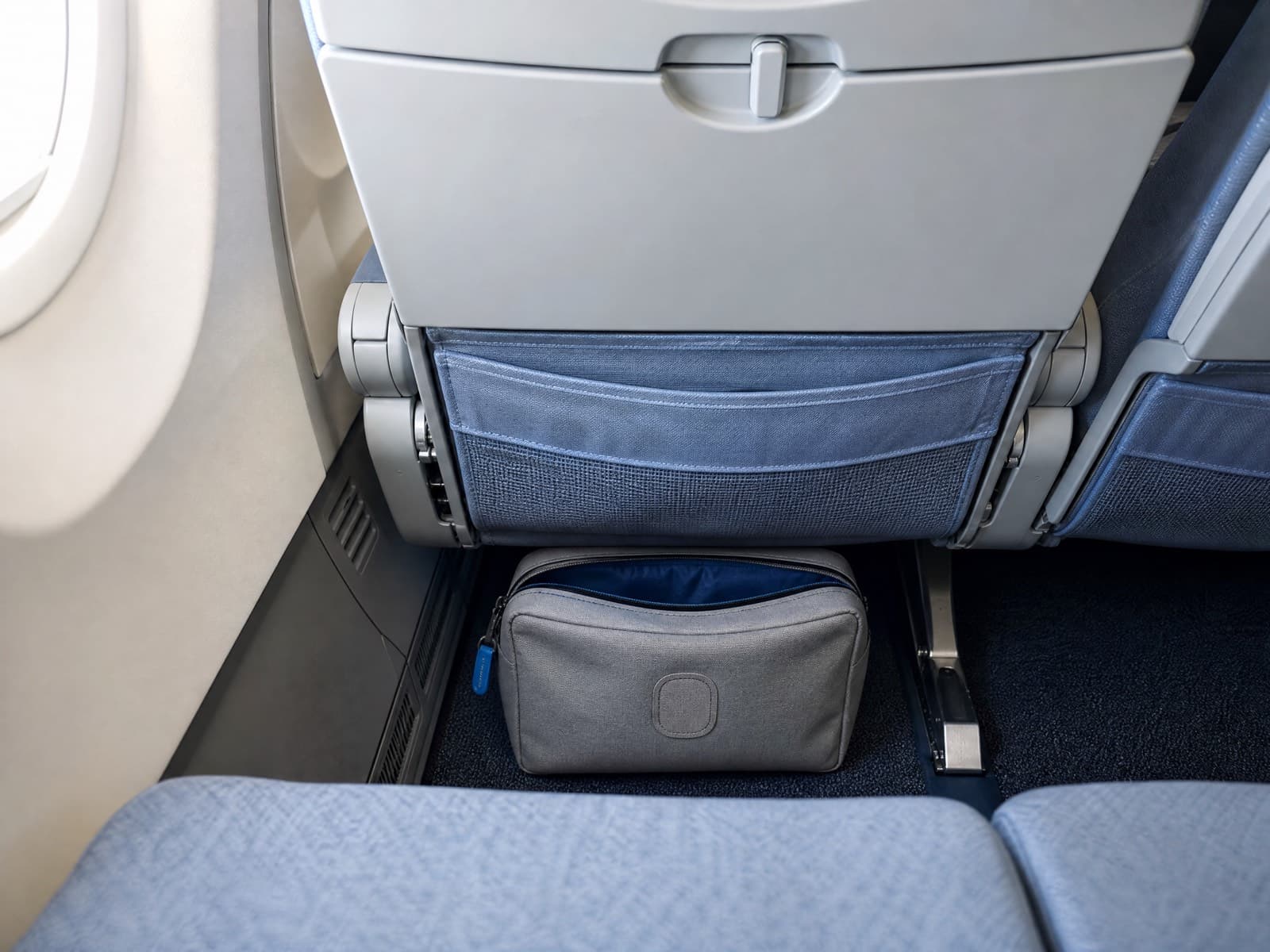 Underseat Bags — The floor space in front of your own seat